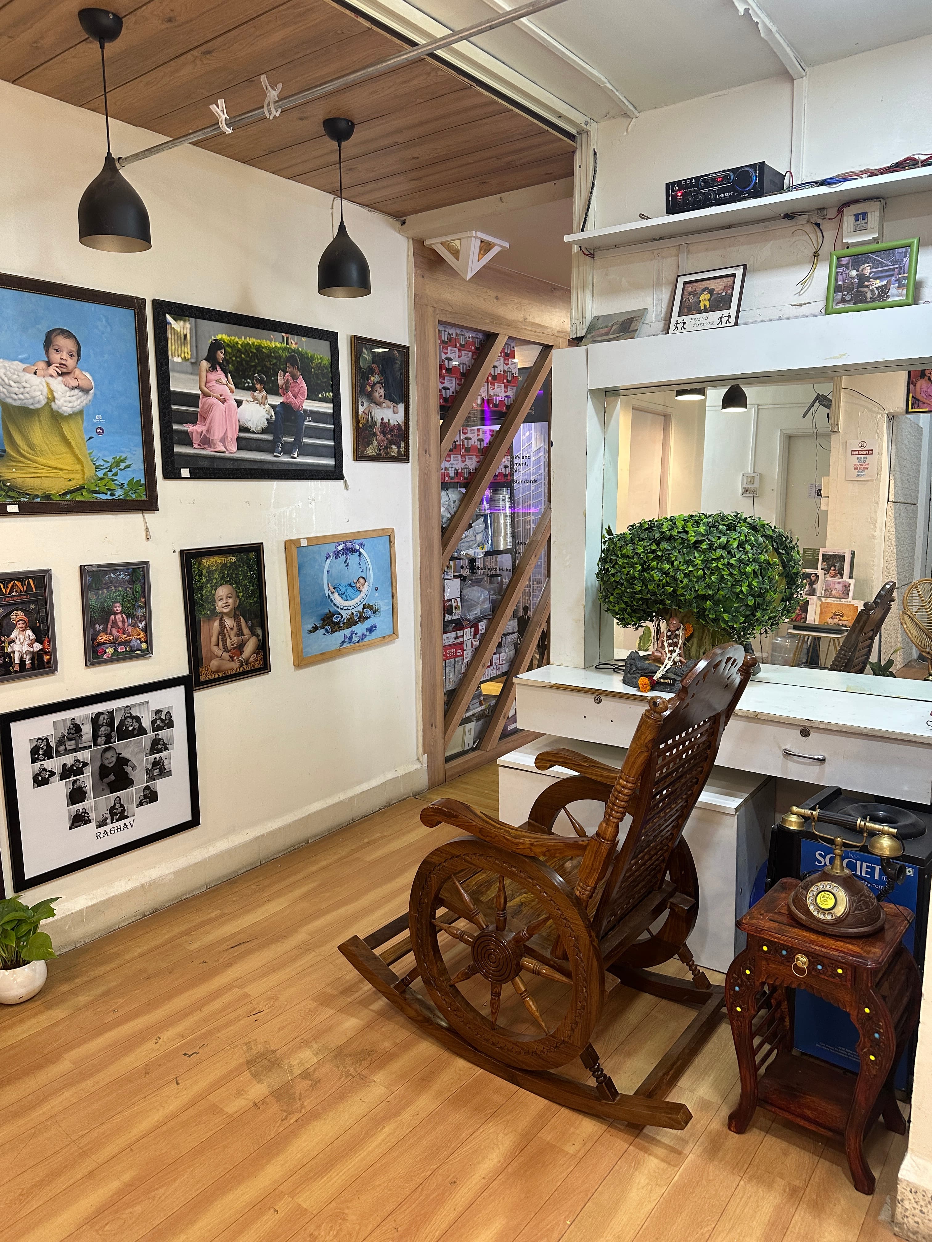 Photo display wall and studio corridor inside IBS Baby Photoshoot office in Pune